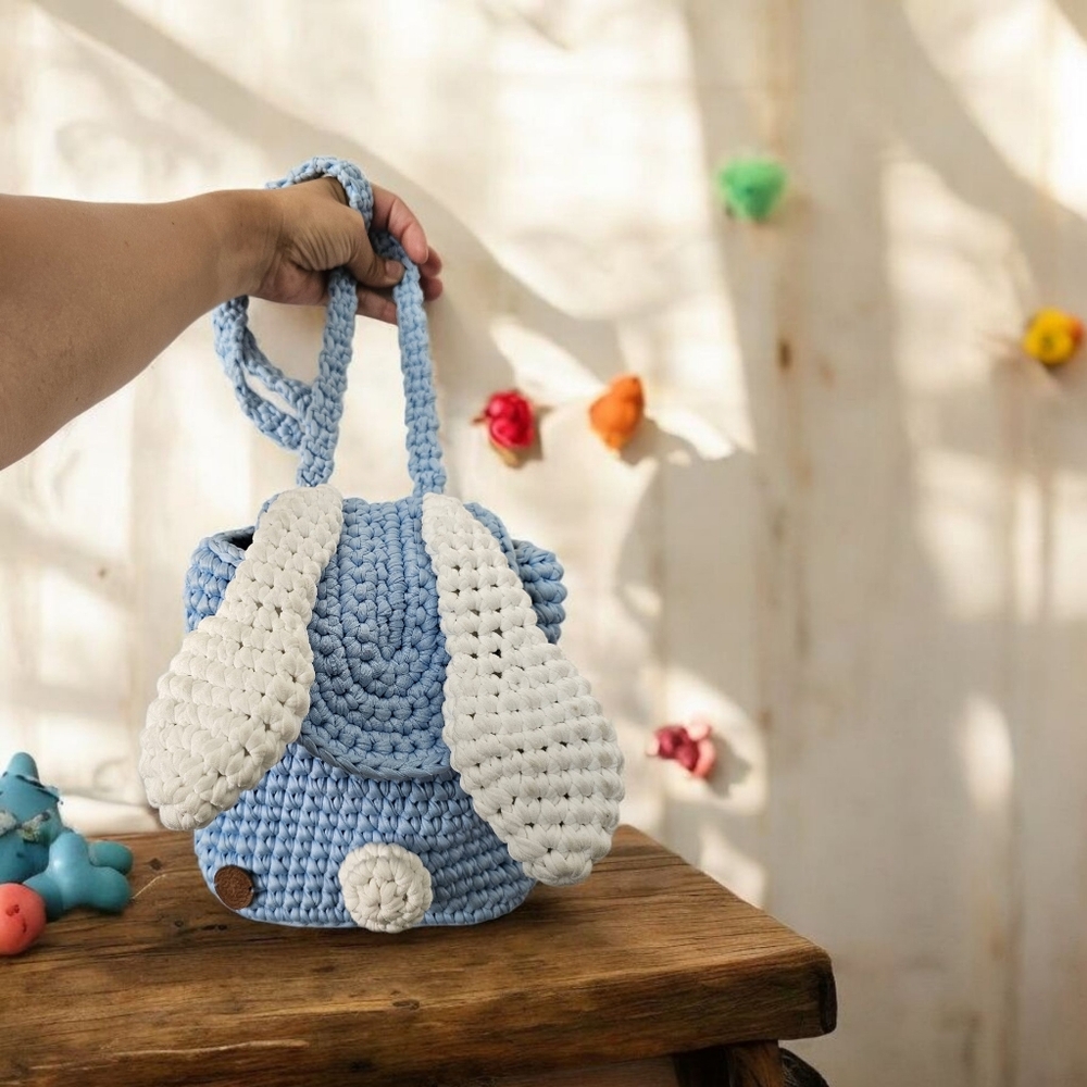 Knitted backpack with rabbit ears for children